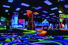 an image of a mini golf game in the middle of a room with neon lights