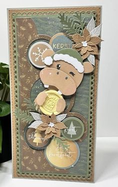 a christmas card with a monkey on it and some other items in the back ground