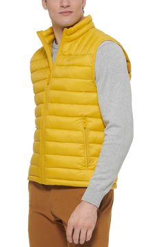 A quilted stand collar and lightweight fill insulate this heat-keeping puffer vest. 26 1/2" length (size Medium) Stand collar Front zip closure Front zip pockets Water resistant 100% nylon Machine wash, tumble dry Imported Sleeveless Nylon Puffer Jacket For Spring, Spring Outdoor Puffer Vest, Functional Spring Puffer Jacket For Outdoor Activities, Fitted Casual Puffer Jacket For Outdoor Activities, Spring Functional Puffer Jacket For Outdoor Activities, Spring Quilted Puffer Jacket For Outdoor Activities, Functional Nylon Puffer Jacket For Spring, Spring Functional Nylon Puffer Jacket, Casual Quilted Nylon Vest