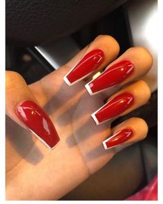 Women will love these gorgeous red coffin acrylic nail design ideas. If you want red and white nails, you're sure to stand out from the crowd with these long nails. Bright Red Nails Acrylic Coffin Long, White Red Tip Nails, Red Black And White Long Acrylic Nails, Red And White Design Nails, Red And White Nails Long, Red White And Gold Nails Acrylic, Red Nails White French Tip, Red And White Graduation Nails, Red Nail Prom