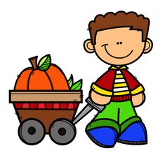 a boy with a wagon full of pumpkins