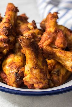 chicken wings in a blue and white bowl