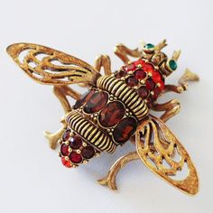 This Gorgeous, Antique-Style Bee Pin Sparkles In A Goldtone Finish With Orange, Red, Cognac And Green Crystals. Detailed Bead Work, Ribbing And Filigree Enhance The Design. The Wings Are Epoxy Enameled In Yellow. Joint And Catch Coil. From Joan Rivers Classics Collection(R) Jewelry. Measures Approximately 2-3/8"L X 1-5/8"W. Joan Rivers Jewelry, Gold River, Bee Pin, Joan Rivers, Green Crystals, Antique Style, Bead Work, Gold Tones, Bee