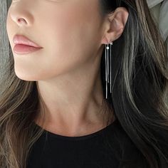 Our Alondra Threader Earrings are dainty chain thread earrings with a square cut cubic zirconia. Minimalist and simple but with a bit of bling, these earrings are perfect for every day wear and adding a little bit of glam to your outfit. 925 Silver + gold plating. Water resistant. Best practice is to keep away from moisture to keep the gold plating last long. Length: about 3in. Elegant Sterling Silver Threader Earrings With Adjustable Chain, Dainty Silver Threader Earrings For Party, Modern Linear Earrings With Adjustable Chain, Sterling Silver Threader Dangle Earrings For Party, Minimalist Dangle Threader Earrings, Sterling Silver Single Threader Earring For Party, Sterling Silver Drop Threader Earrings For Party, Minimalist Long Drop Threader Earrings For Parties, Silver Sterling Linear Earrings With Adjustable Chain