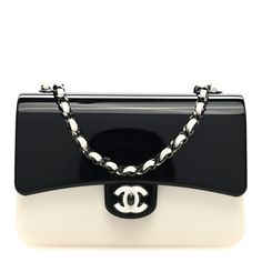 This is an authentic CHANEL Plexiglass Plexi Coco Bag in Black and White. This stunning crossbody is crafted of smoothly polished black and white plexiglass with the CC logo on the flap. The bag features a white leather-threaded dark silver chain crossbody strap and a magnet that opens the bag to a compact black leather interior with a card slot. Chanel Print, Chanel Crossbody, Pearl Clutch, Chanel 19, Chanel Tweed, Heart Bag, Leather Thread, Camera Case, Cc Logo