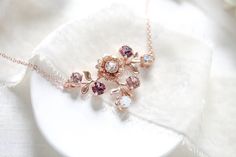 "A lovely floral rose gold bridal necklace with crystal in blush hues. - Handmade to order with Premium European Crystals - antique pink, white opal, vintage rose, light silk stones - Rose gold plated brass - Available in other finishes and crystals upon request - Necklace measures 16 inches and extends to 18 inches - Pendant measures 1.5\" x 1-1/8\" - Each piece is gift wrapped Matching earrings: https://www.etsy.com/listing/560510013/rose-gold-earrings-bridal-earrings?ref=shop_home_active_1 Br Vintage Bridal Necklace, Gold Flower Necklace, Bridal Statement Necklace, Monogram Necklace Gold, Flower Girl Necklace, Handmade Crystal Necklace, Gold Bridal Necklace, Red Beaded Necklaces, Jewelry Opal