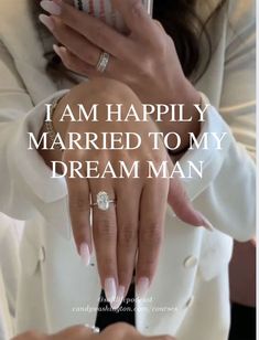 a woman holding a cell phone in her hand with the words i am happily married to my dream man