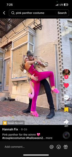 two people in pink outfits are hugging on the street