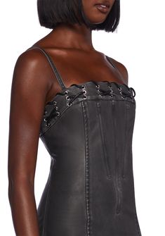 This fully lined mini dress has a matte vegan leather construction, structured boning on the front and back, side slits, a lace-up design at the neckline, adjustable shoulder straps, and a back zipper closure. Gothic Corset Dress With Straps For Night Out, Leather Corset With Corset Back For Party, Fitted Leather Corset For Evening, Leather Fitted Corset For Evening, Black Corset Dress With Adjustable Straps, Leather Party Corset, Gothic Leather Corset For Party, Sleeveless Leather Mini Dress For Club, Black Leather Evening Corset