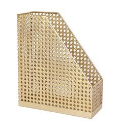 a gold metal basket with holes on the front and bottom, sitting on a white surface