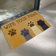 a door mat that says wipe your paws