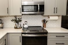 the kitchen is clean and ready for us to use it's new stainless steel appliances