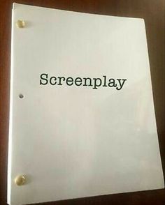 a sign that says screenplay on it