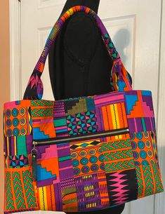 "Abu is a vibrant, Multi-Color Purple ToneTote Bag. It is one of our best selling bags. This is a small/medium size Tote. It's perfect for carrying your essentials. It features: -19\" Shoulder Straps -Double Slip Interior pockets -Magnetic snap closure -Front Exterior zipper pocket -Zipper Pull -Key Holder Dimensions: 16 inches wide x 9 inches height Matching Clutch and Wallet available separately" Multicolor Crossbody Shoulder Bag For On-the-go, Trendy Zipper Pouch Shoulder Bag, Trendy Satchel Shoulder Bag With Zipper Pouch, Casual Multicolor Bags With Large Capacity, Casual Multicolor Large Capacity Bag, Trendy Shoulder Bag With Zipper Pouch, Casual Multicolor Shoulder Bag With Large Capacity, Casual Multicolor Large Capacity Shoulder Bag, Casual Multicolor Large Capacity Satchel