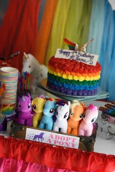 a table topped with lots of different types of cakes