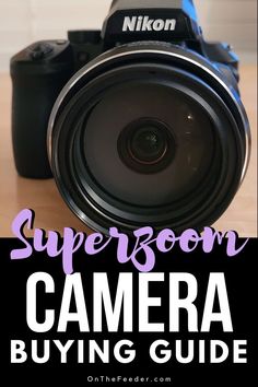 a camera sitting on top of a wooden table with the words super zoom camera buying guide