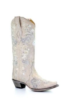 a pair of white cowboy boots on a white background