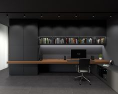 an office area with desk, bookshelf and computer on the wall in front of it