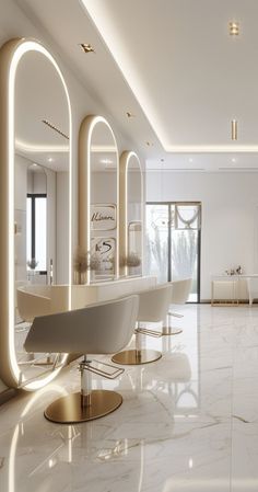 the interior of a modern salon with white marble flooring and gold trimmings