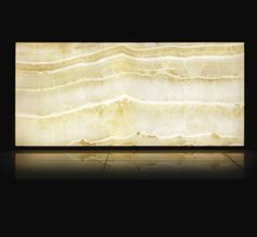 a large white marble slab in a dark room