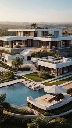 an aerial view of a modern house with pool in the foreground