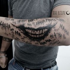 a man with a tattoo on his arm that has words written all over it