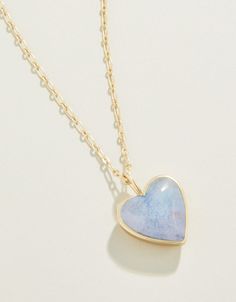 Capture that warm feeling of a full heart in this lovely stone necklace. A thick piece of light blue dyed jade is set in a lustrous 18kt matte gold plated setting on a classic oval chain. Timeless and lovely. Please note: This design features natural stones and each piece is one-of-a-kind. Colors and patterns may vary slightly from the image shown. Spartina 449, Matte Gold, Heart Earrings, Plate Sets, Stone Necklace, Heart Necklace, Semiprecious Stones, Precious Stones, Design Features