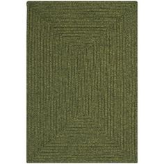 a green rug with an interlocked design on the front and back side,