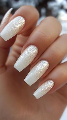 #white nail art #white nails art #nail #nail ideas #nail design #nail inspo #nail acrylic #acrylic nail #minimalist nail #short nail #red nail #white nail #nail art #nail art design #trendy nail #gel nail #elegant nail #short nail design #simple nail #nude nail #simple nail design #black nail #classy nail #cute nail #nail inspiration White Nails Glitter Accent, White Glitter Acrylics, White Nails With Black Glitter, White Gold Glitter Nails, Sparkling White Nails, White Nails With White Glitter, Holiday White Nails, Wedding Bride Nails Ideas, White Fall Nail Ideas