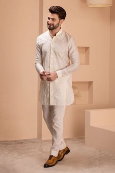 Cream silk kurta with crochet embroidery and cuffes sleeves. - Aza Fashions Embroidered Nehru Jacket For Eid Wedding, Eid Wedding Nehru Jacket With Embroidered Sleeves, Traditional Raw Silk Kurta With Embroidered Sleeves, Traditional Sherwani With Embroidered Sleeves, Traditional Wear With Embroidered Sleeves For Wedding And Diwali, Traditional Kurta With Embroidered Sleeves For Transitional Season, Traditional Navratri Kurta With Embroidered Sleeves, Traditional Embroidered Kurta For Navratri, Kurta Men