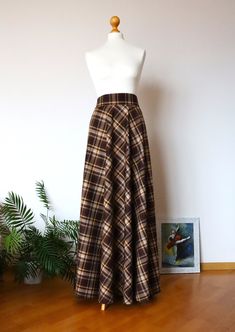 "Winter plaid skirt Plaid skirt  Wool skirt  women Midi skirt Winter skirt  Long tartan woman skirt Skirt with pocket Wool skirt Warm skirt  The skirt has two pockets. The skirt has a removable belt. The skirt has a zipper. Full standart length (from waist to hem) - \"43'' / 110cm . I can customize this skirt in every size and length free of charge, just send me measurements. Also available in other colors:  Red tartan maxi skirt :  https://www.etsy.com/listing/657341561/red-tartan-maxi-skirt-re Brown Plaid Maxi Skirt, Fall Full Length Lined Skirt, Fall Full Length Brown Maxi Skirt, Brown Full-length Maxi Skirt For Fall, Brown Full Length Maxi Skirt For Fall, Lined Mini Wrap Skirt For Fall, Fitted Long Brown Skirt, Full Length Lined Pleated Skirt, Vintage Flowy Mini Skirt