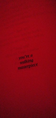 the words you're a walking masterpiece written in black on a red background