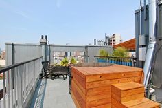 an outdoor hot tub on the roof of a building