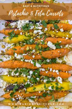 a white plate topped with carrots covered in feta cheese and parmesan