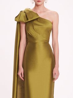 Make a bold statement in the Silk Mikado Midi Dress. Crafted from silk mikado, this one-shoulder cocktail dress features a dramatic bow and shoulder train detail, adding an element of flair to any special occasion. Shoulder Training, One Shoulder Cocktail Dress, Marchesa, Evening Gown, Evening Gowns, Special Occasion, One Shoulder, Cocktail Dress, Midi Dress