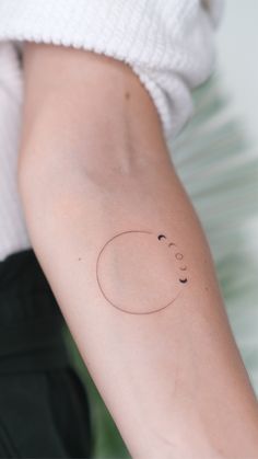 a person with a small tattoo on their arm