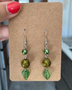 Get in tune with nature with this stunning pair of leaf green earrings 🍃 perfect for summer or any fun occasion! - Lightweight and designed for comfort  - Sterling silver earring hooks  - Perfect quality  Message me if you have any questions at all :) Green Dangle Flower Earrings For Gift, Green Leaf-shaped Jewelry Gift, Elegant Green Leaf-shaped Earrings, Green Leaf-shaped Earrings As A Gift, Green Leaf-shaped Earrings For Gift, Handmade Green Flower Drop Earrings, Nature-inspired Green Dangle Flower Earrings, Nature-inspired Green Dangle Jewelry, Green Nature-inspired Dangle Jewelry