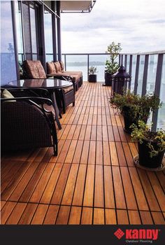 a balcony with chairs, tables and potted plants