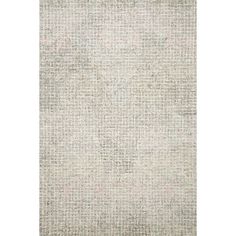 an area rug with white and grey squares on the top, in front of a white background