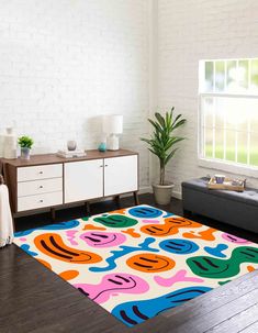 a brightly colored area rug in a living room