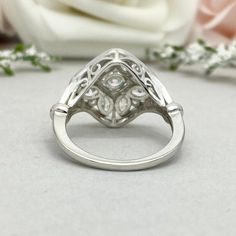 This beautiful ring is made from genuine 925 sterling silver with rhodium plating. Ring details- -The Main stone is a round cut 4mm Simulated Diamond -Side stones are 4mm by 2mm Marquise and 1.5mm Round simulated diamonds -Ring is casted in solid 925 sterling silver with rhodium plating (yellow gold and rose gold plated also available, please check the drop down menu for more options) -The Total face height of the ring measures 16mms and the band width measures 5mms -Each ring is handmade and ma Elegant Dome Ring For Promise, Classic Promise Dome Ring, Classic Dome Promise Ring In Cubic Zirconia, Classic Cubic Zirconia Dome Ring For Promise, Round Sterling Silver Dome Wedding Ring, Sterling Silver Dome Wedding Ring, White Gold Sterling Silver Dome Ring For Anniversary, Sterling Silver White Gold Dome Ring For Anniversary, Classic Silver Rings With Diamond Accents