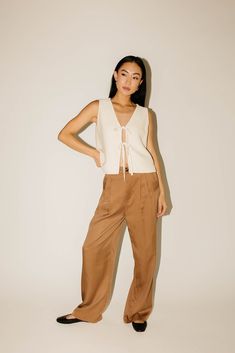 engineered for endless compliments, these wide leg pleated trousers will take any outfit idea to chic new levels. kinda baggy + kinda slouchy, we love them paired with a blouse + heels for the office, or a cropped tee + flats for casual date nights. mushroom // high waisted, wide leg, one button fly zip, belt loops, front pockets, pleat detailing paired with our good graces vest // beige model is 5'8" + wearing a small measurements are approximate + taken while laying flat small : waist 25” inse Wide Leg Pleated Trousers, Casual Date Nights, Fall Nights, Date Nights, Pleated Trousers, Casual Date, Cropped Tee, Knit Vest, Large Bust