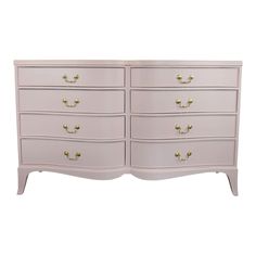 a white dresser with gold handles and drawers on it's sides, against a white background