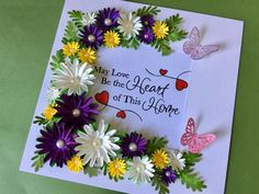 a card with flowers and butterflies on it