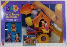 a toy house with winnie the pooh and other toys in it's box