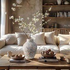 a living room filled with furniture and a large vase on top of a coffee table