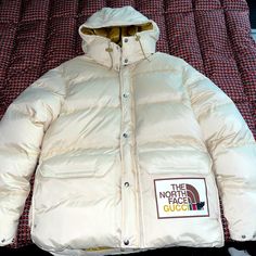 Mint Condition! Authentic Gucci X The North Face Down Jacket- Worn Once! Comes With Original Gift Bag, Garnet Bag, And Detachable Hood. Selling For $2500 Obo. Gucci Long Sleeve Cream Outerwear, Gucci Cream Long Sleeve Outerwear, Luxury Gucci Hooded Outerwear, Luxury Hooded Gucci Outerwear, Gucci Cream Winter Outerwear, Fitted White Gucci Outerwear, Beige Gucci Outerwear For Winter, Gucci Beige Outerwear For Fall, Fitted Gucci Beige Outerwear