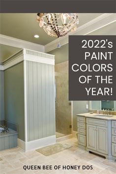 a bathroom with a chandelier and vanity in the background, is featured for queen bee of honey dos's paint colors of the year