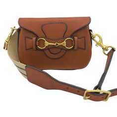 This all fabulous day bag has been a mega. A reduced size of the best selling Blair Crossbody, this luxe little bag packs a huge punch of style and gorgeous bridle leather that is so smooth it has all of us swooning. All solid equestrian hardware, gorgeous topstitching and a stunning contrast suede interior. Perfect for a small wallet, phone and keys. Detach the leather and webbing signature strap and you have an equally gorgeous clutch. Benchmade by our master harness makers, one by one, just f Luxury Saddle Satchel For Daily Use, Beige Travel Bag With Horsebit Detail, Brown Shoulder Bag With Horsebit Detail, Chic Shoulder Bag With Horsebit Detail For Travel, Designer Brown Saddle Bag For Daily Use, Chic Travel Shoulder Bag With Horsebit Detail, Travel Shoulder Bag With Horsebit Detail, Luxury Saddle Shoulder Bag For Everyday Use, Brown Horsebit Shoulder Bag