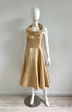 Vintage 1950s gold lurex halter dress with quilted circle skirt. Back metal zipper, boning on bodice, ties behind back neck, bodice is lined. No labels, fits like a small. Excellent vintage condition - stain on inside neck, not visible when worn. Please message me with any questions.  Measurements bust 34-36 waist 26 hip 74 length (from underarm) 39 more vintage clothing  https://www.etsy.com/shop/prizesforarla instagram: prizesforarla international buyers: Please note that your order may be subject to customs charges and taxes. Please check the laws pertaining to your country for details Pin Up Dresses, 50s Dresses, 1950s Dress, Metal Zipper, Circle Skirt, Dress Clothes For Women, Vintage 1950s, Vintage Clothing, Halter Dress